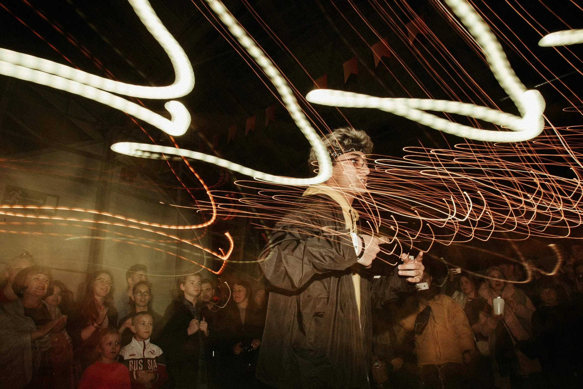 a man with camera shooting long exposure and lights