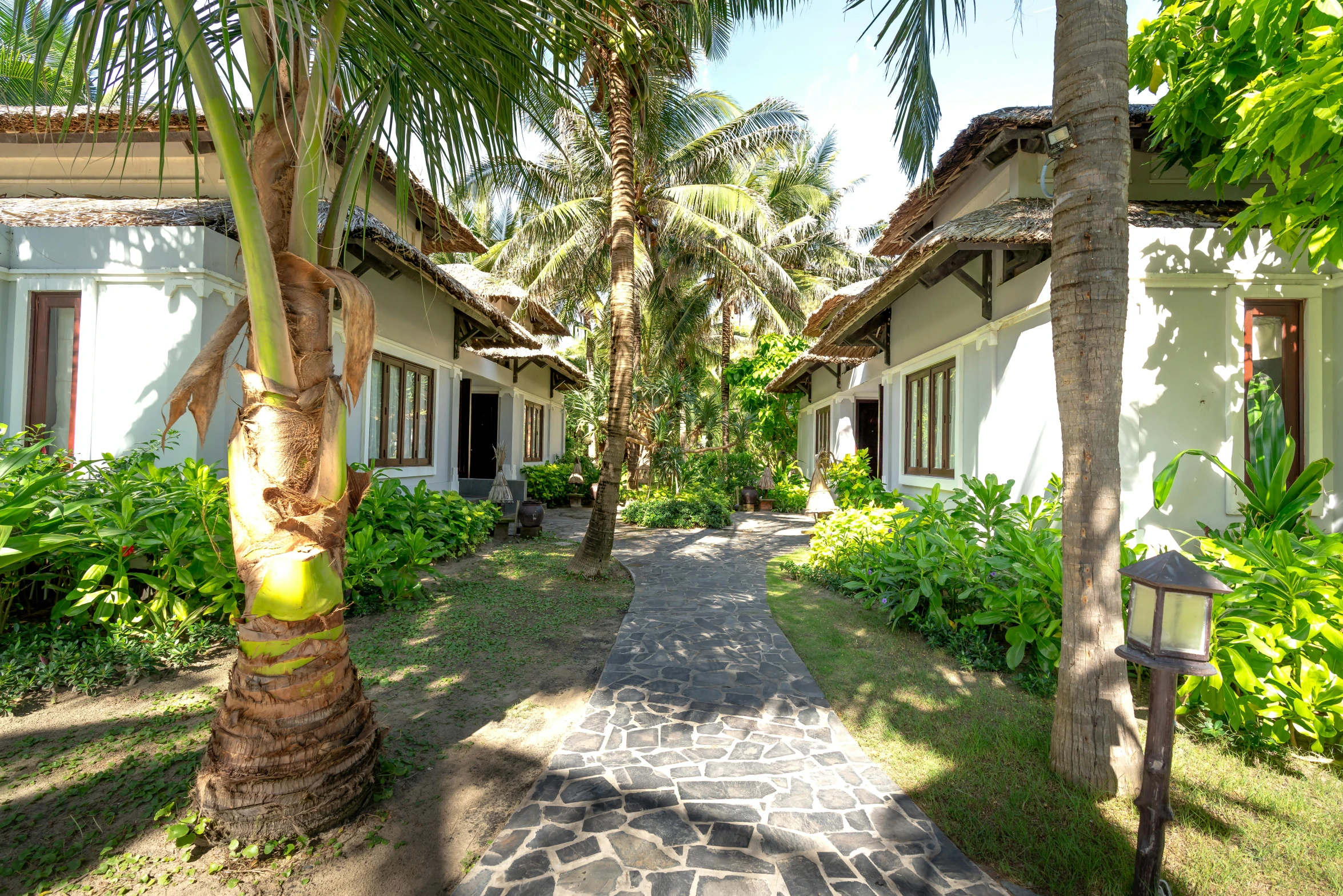 the view down an elegant walkway at a resort