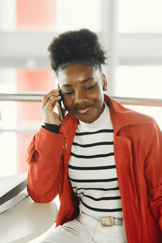 woman talking on a cellphone while looking down