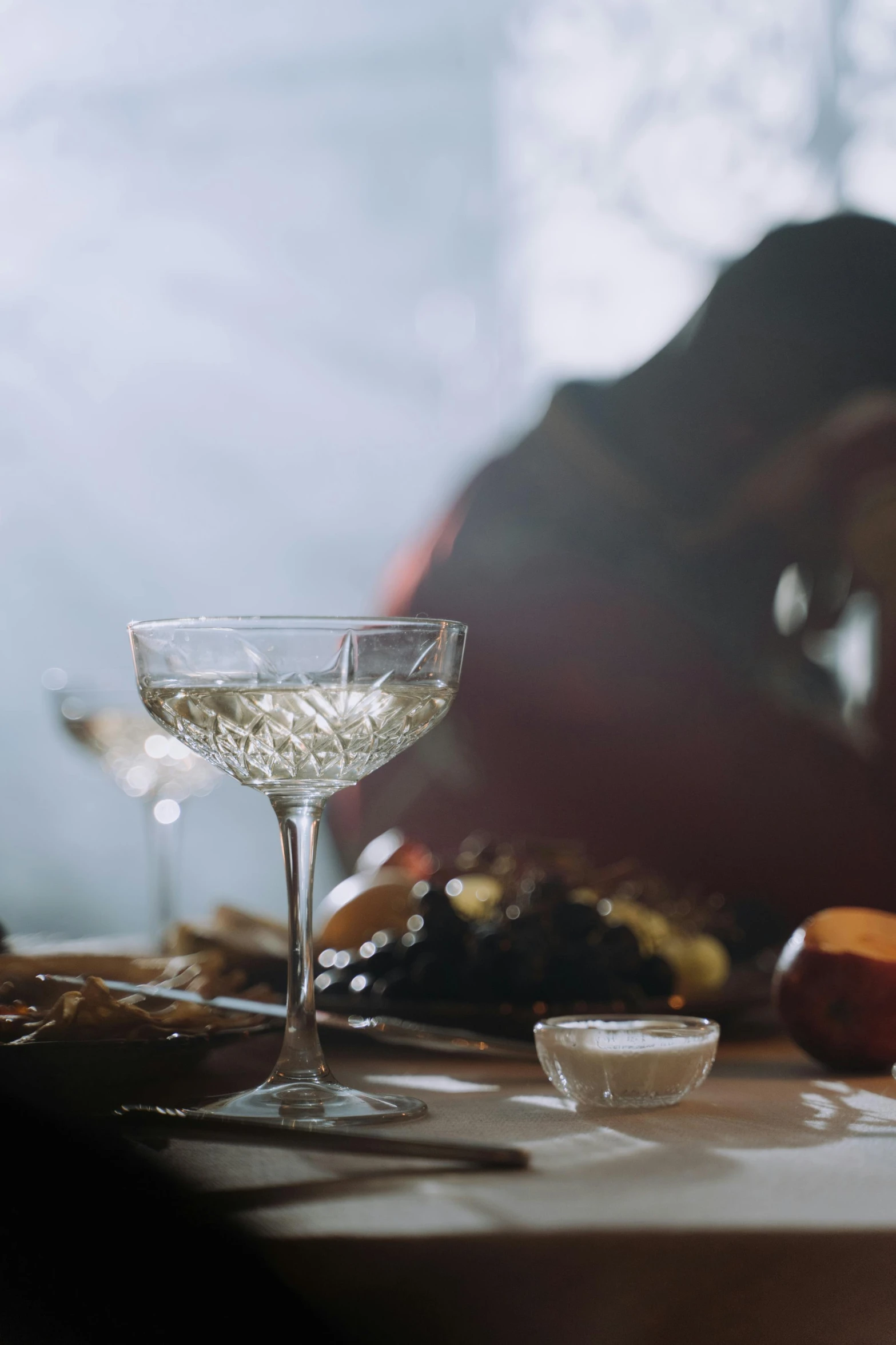 the table is ready to be set with a glass and plate full of food