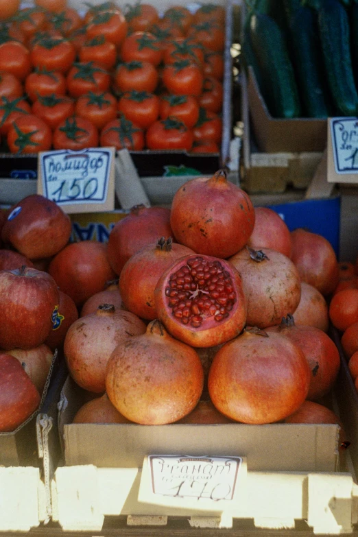 the fruit is in the boxes on the stand