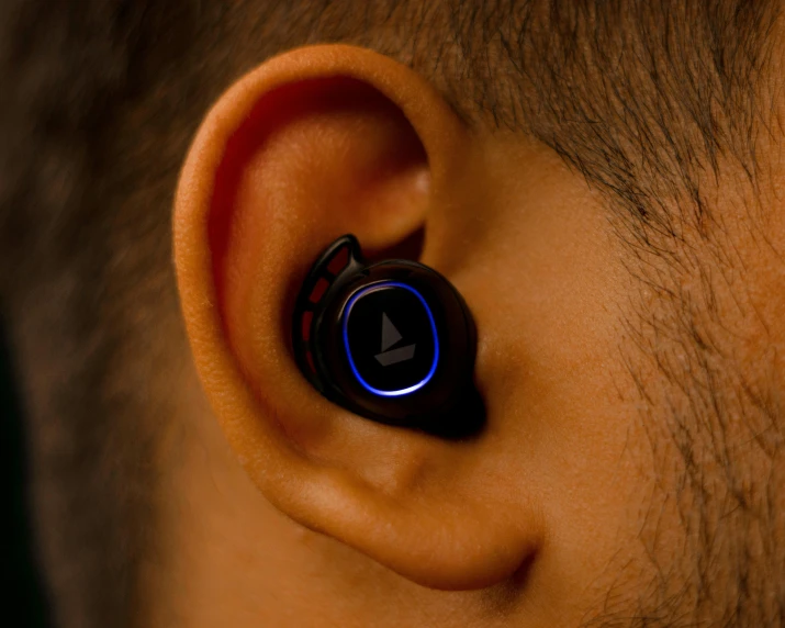 the inside of an ear is illuminated blue