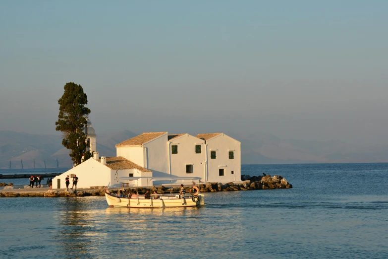 a house sitting on the water's edge