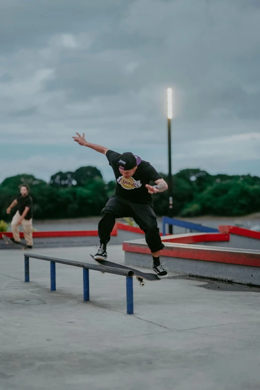 the man is jumping off a skateboard rail