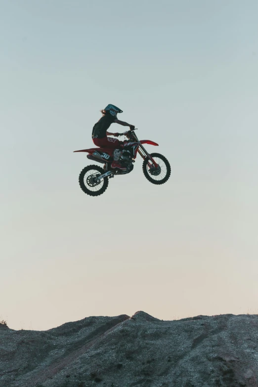 an image of a person on a motorcycle that is doing stunts