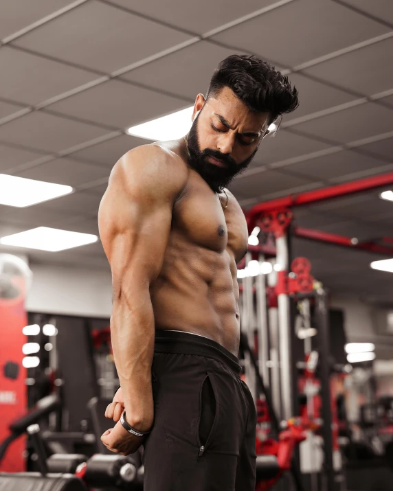 a man with a beard and  in the gym