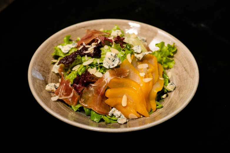 this is an image of a bowl with salad in it