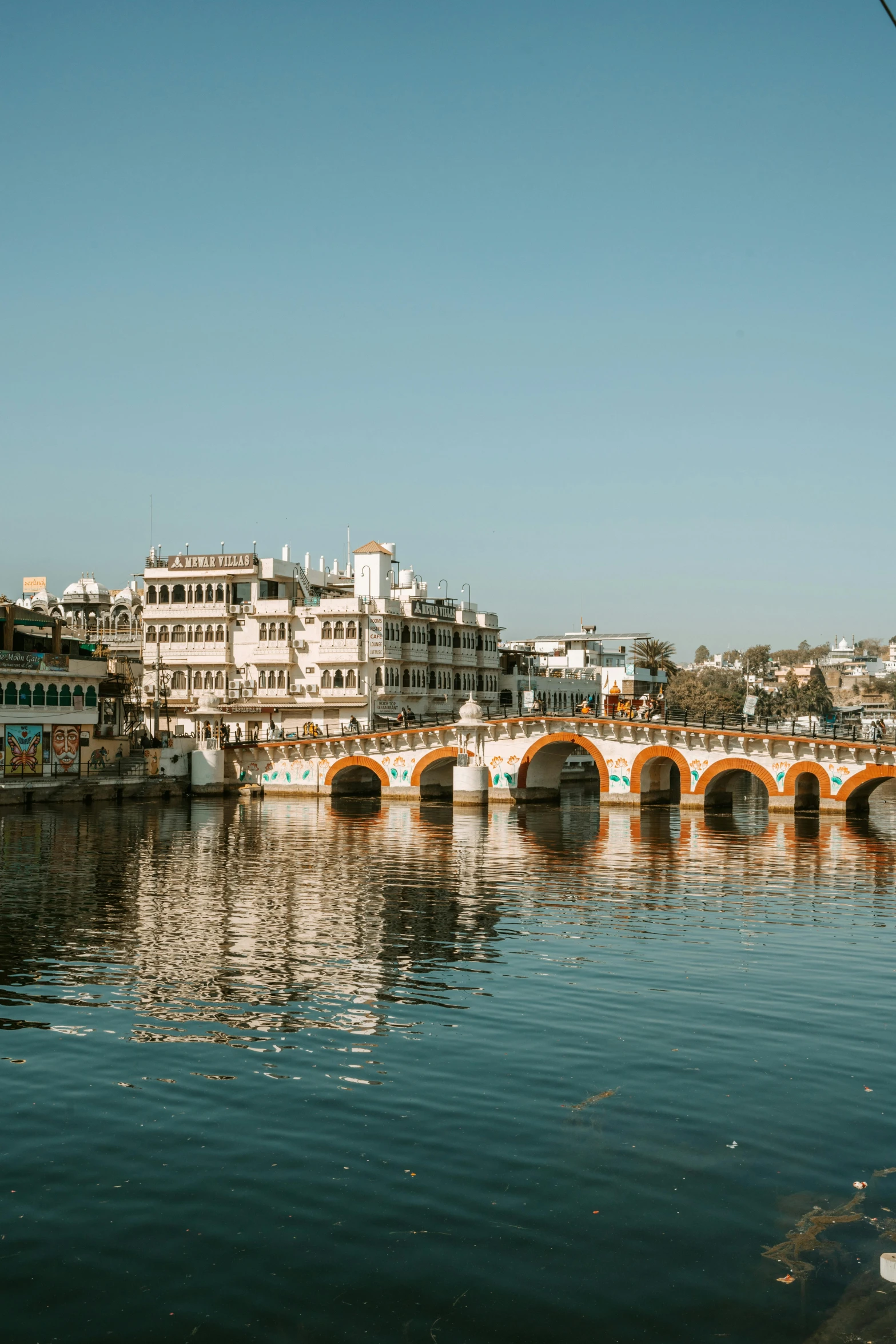 a po of some bridges and buildings by the water