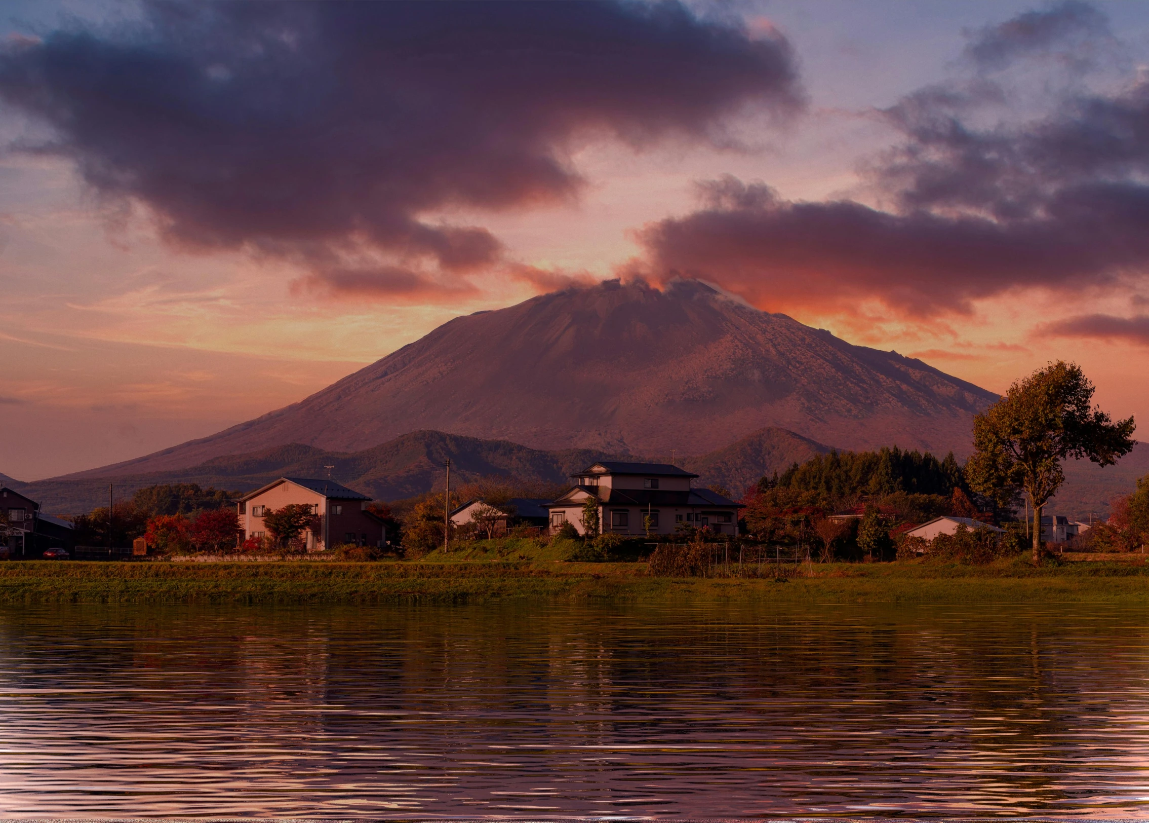 a lake at the foot of a large mountain