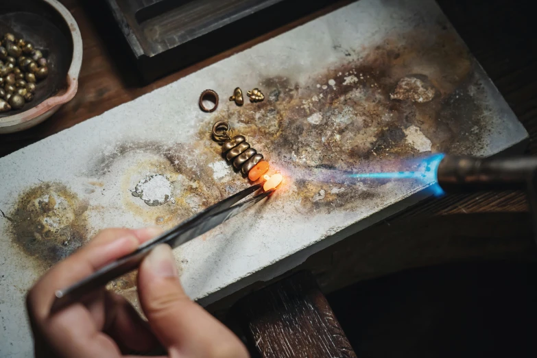 a person is using a knife to cut through soing with scissors