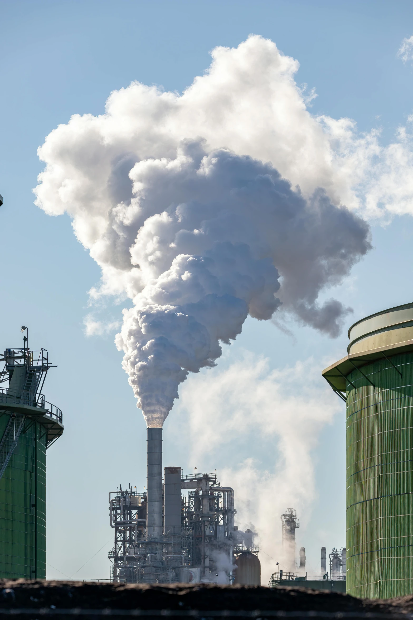 smoke from the chimney of a factory stack