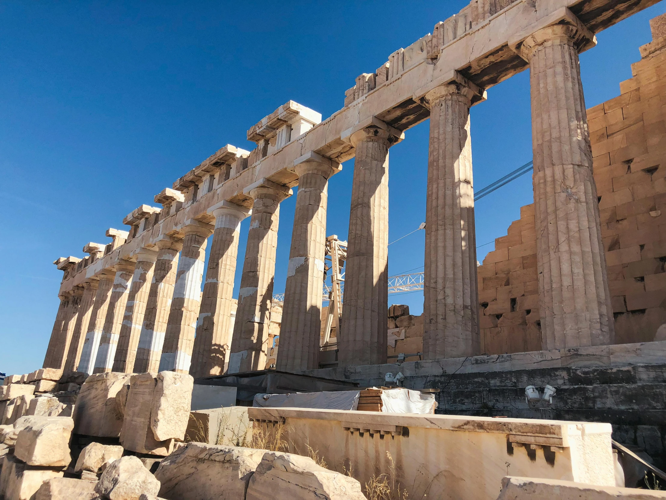 the ruins of a large building and an array of columns