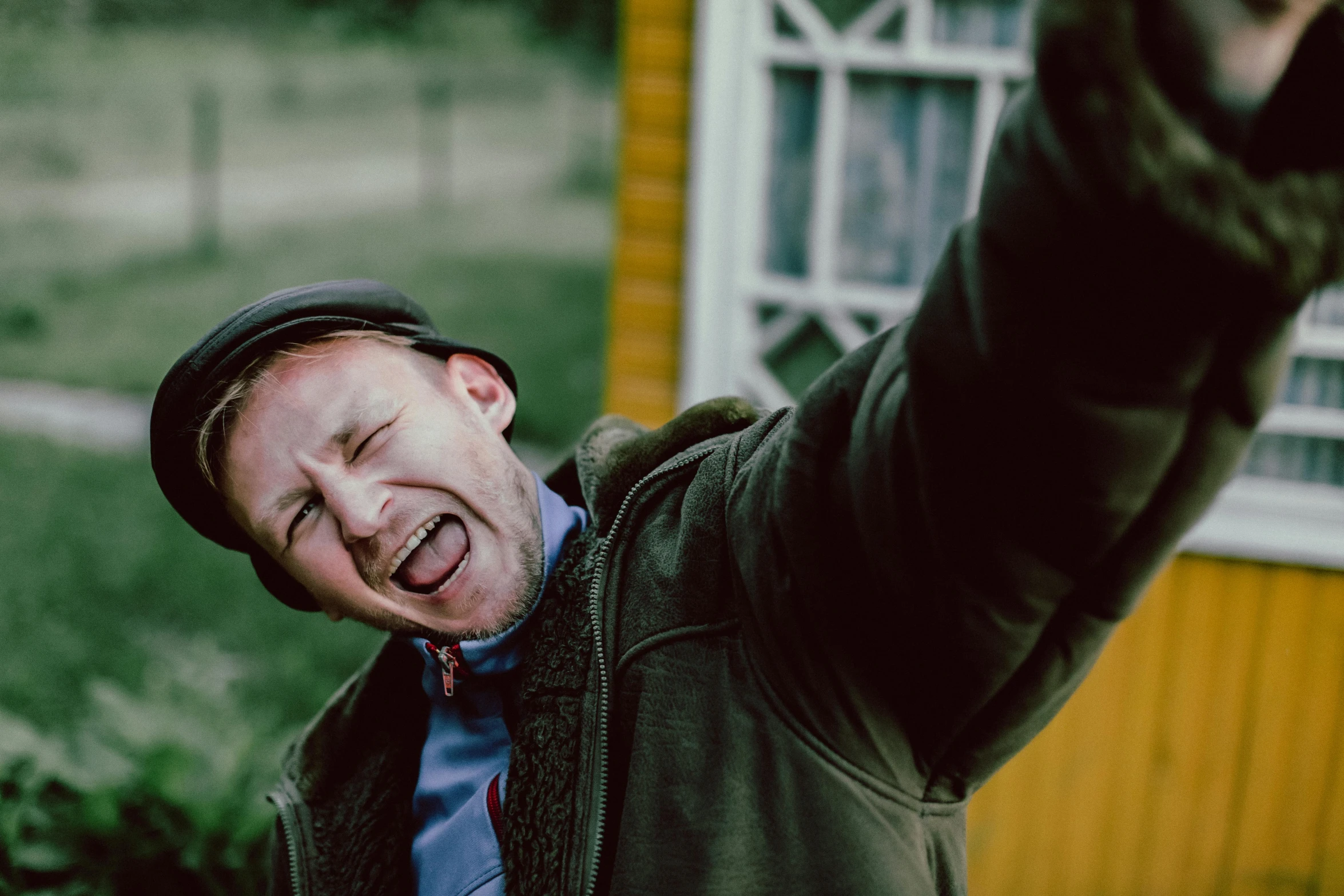 a man making a goofy face with his finger