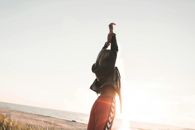 a person that is standing in the sand