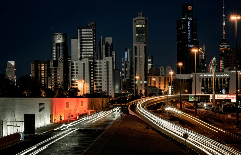 a nighttime view of a city with high rise buildings