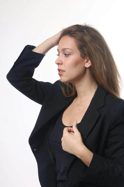 the woman is fixing her hair and putting it on