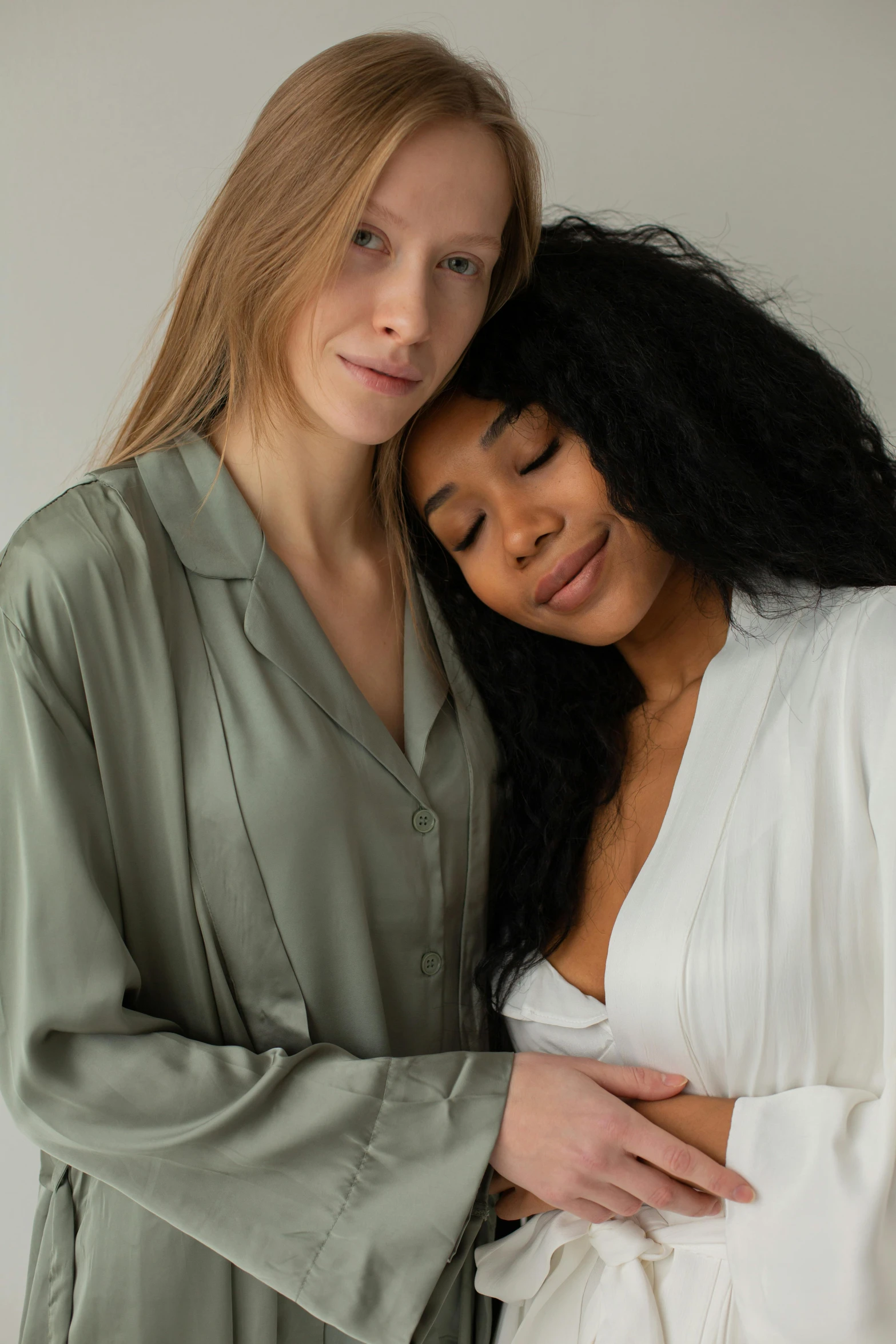 two young women are posing for a po