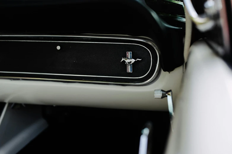 the dashboard of a car has the emblem's badge on it