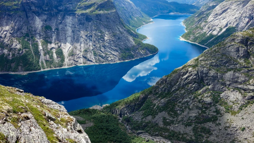 a big mountain that is by some water