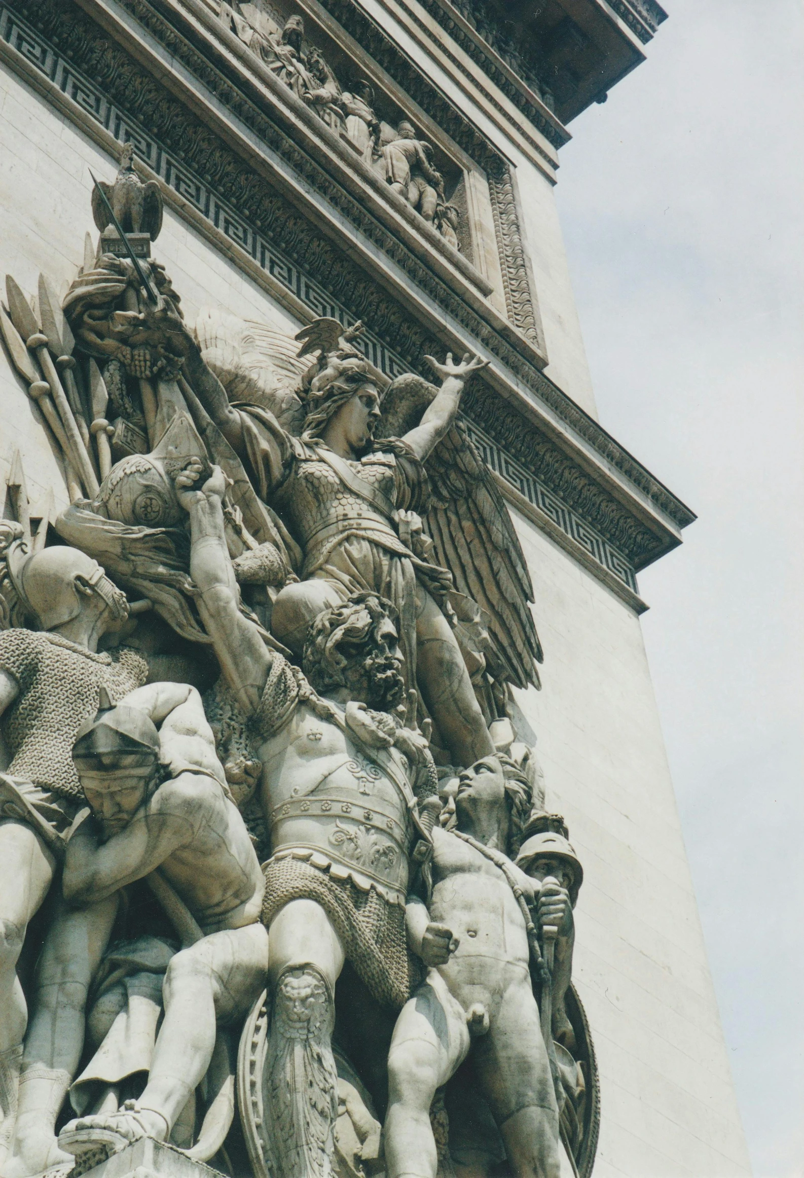 a very tall statue with many different statues