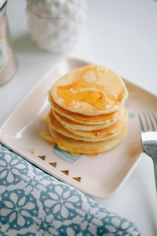 pancakes with er and syrup on a plate