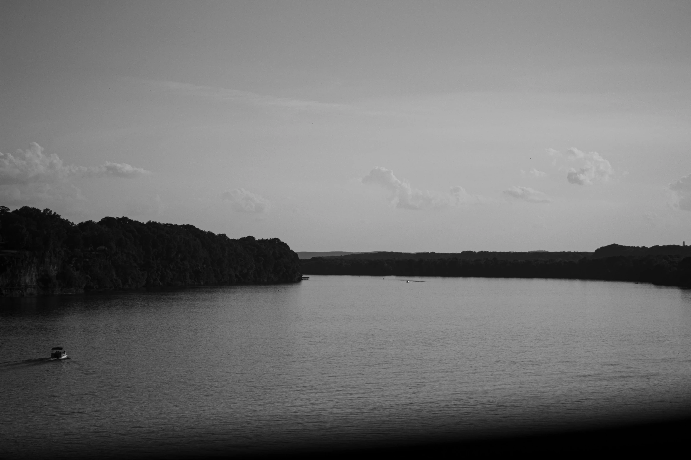 a man in a boat traveling on the water