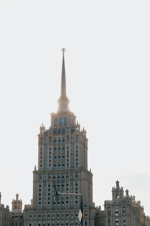 a very tall building with a cross on top of it