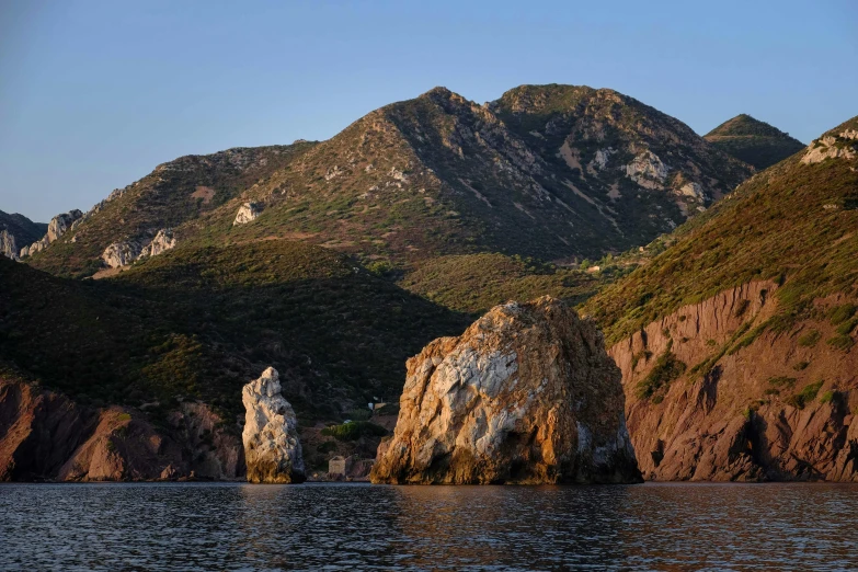 rocks with trees and mountains in the background