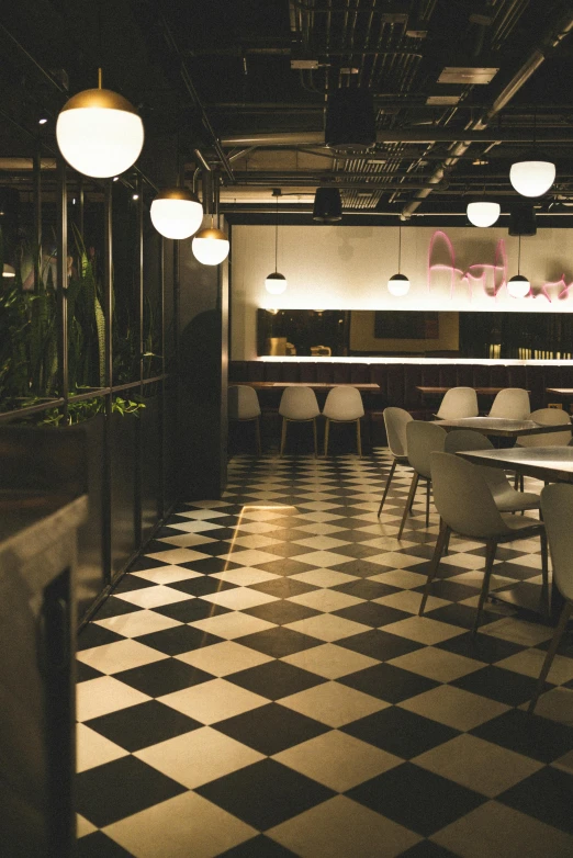 a checkered floor and black and white tile in a restaurant