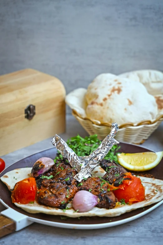 some meat and some vegetables are on a brown plate