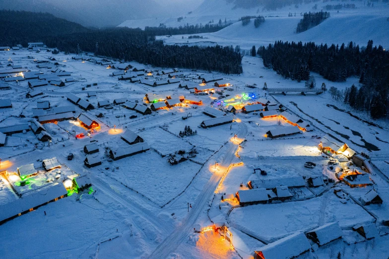 an aerial view of a ski resort in the snow