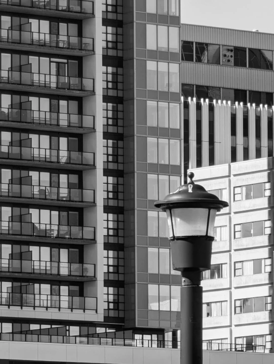 a lamp post is in front of several buildings