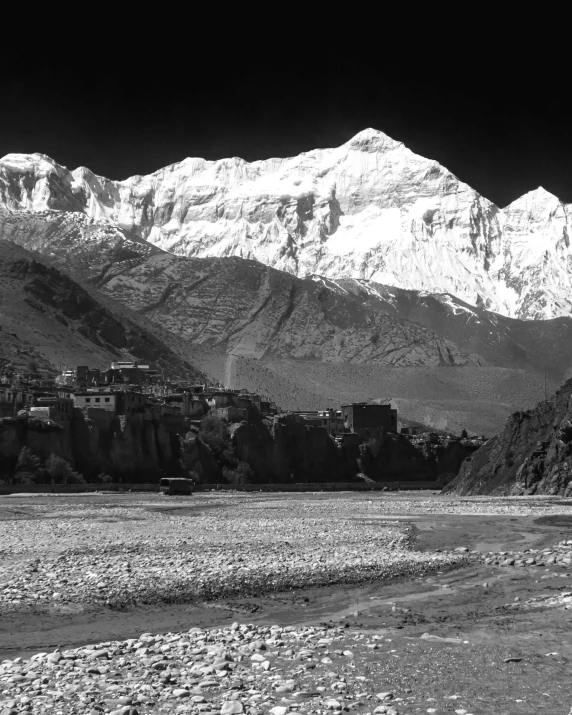 a black and white po of mountains in a desert