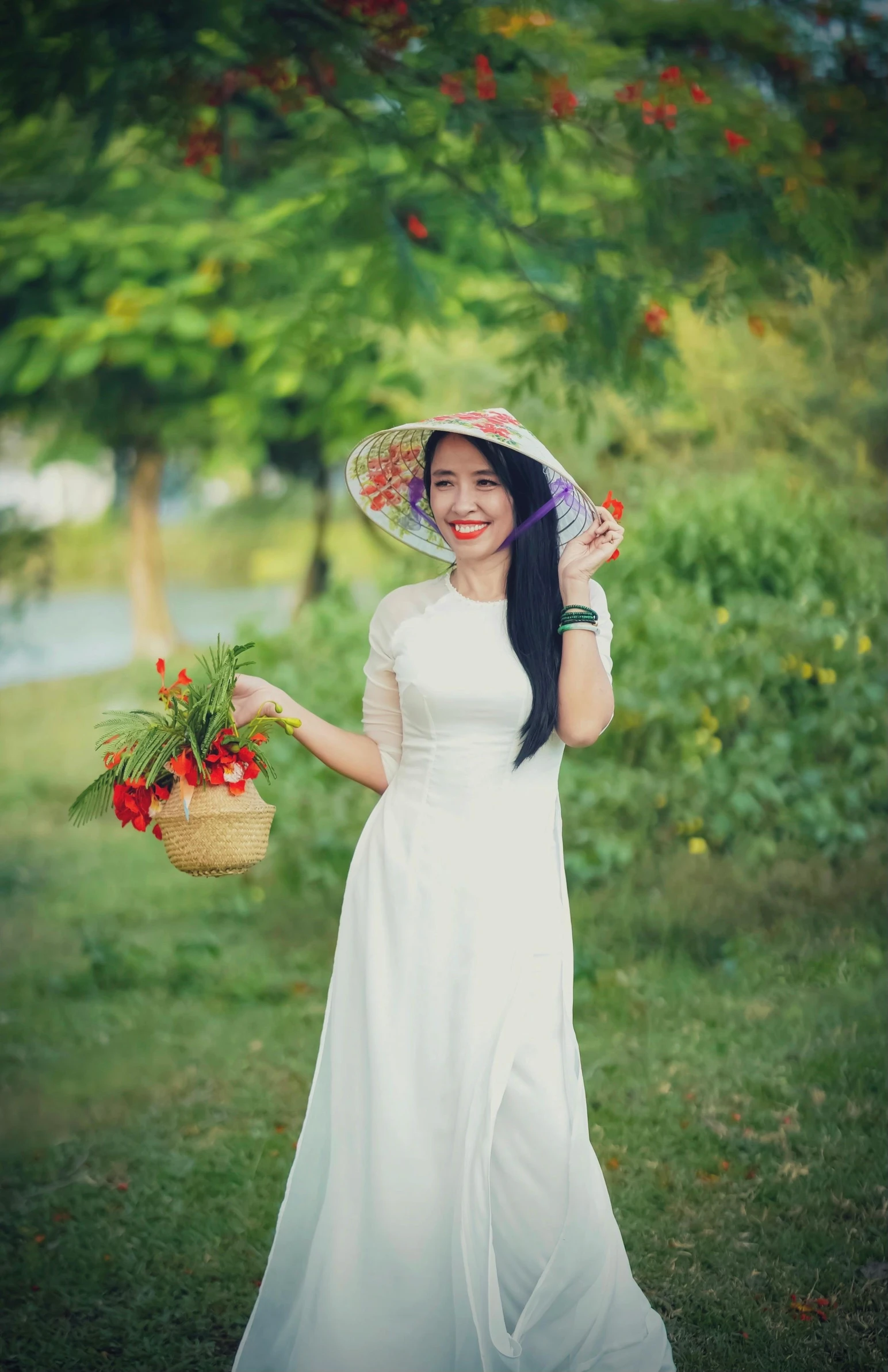 a woman in white dress holding a basket with tomatoes and an umbrella