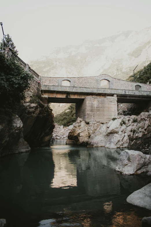 an image of a bridge in the mountains