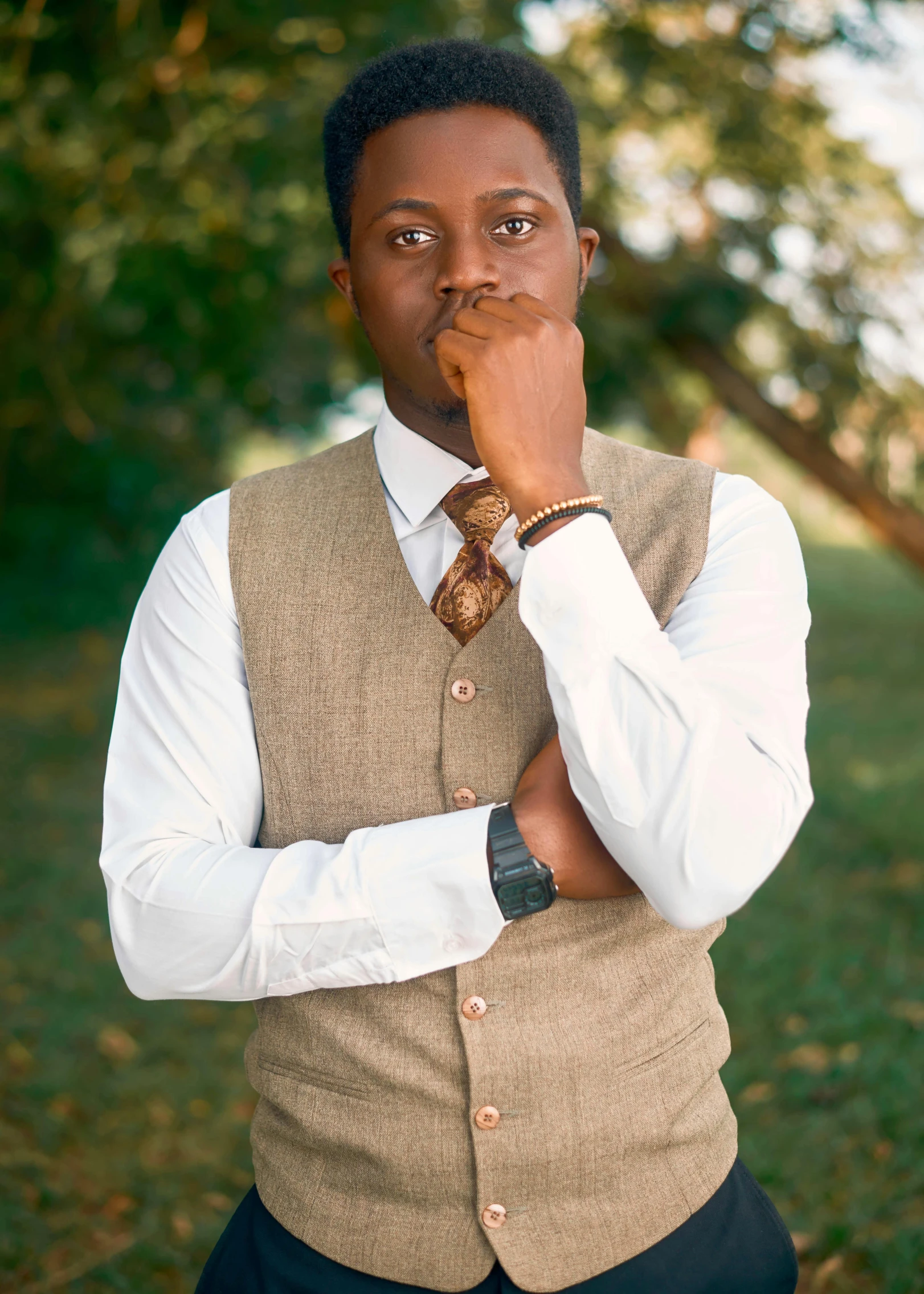 a man is thinking while wearing a vest