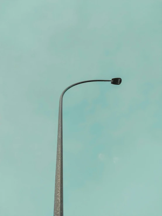 street lamp on street post against blue sky