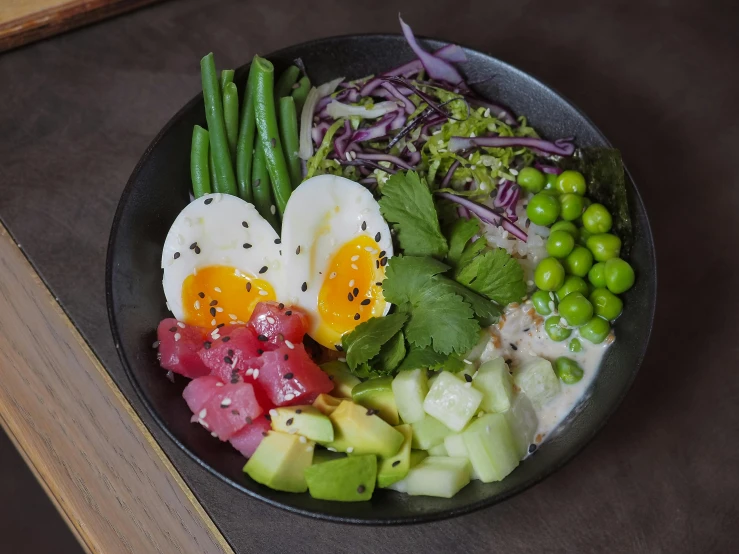 a healthy meal served in a small black bowl