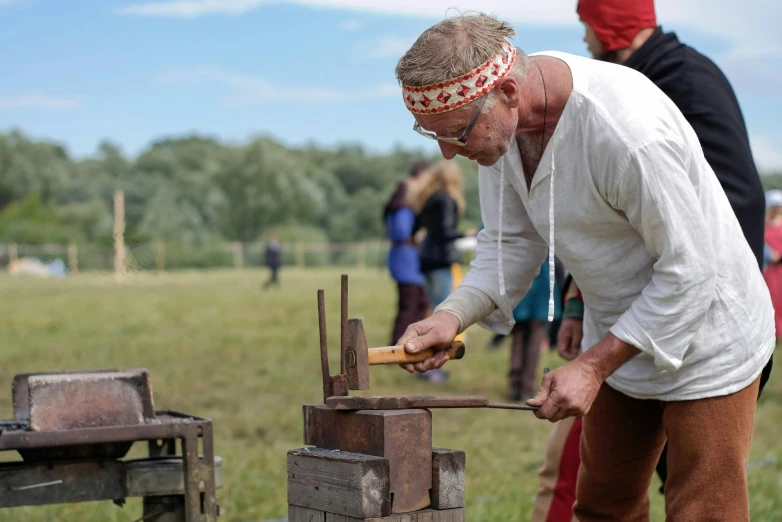 a man is making a piece of wood