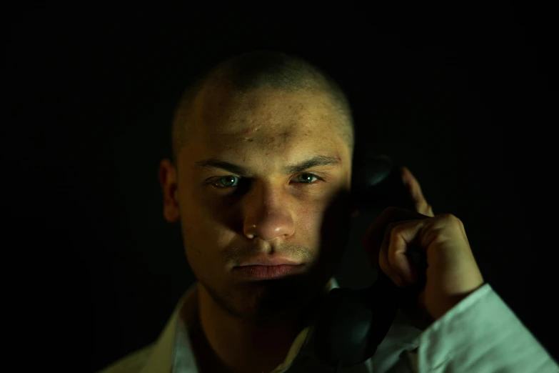 man holding a phone in front of his face