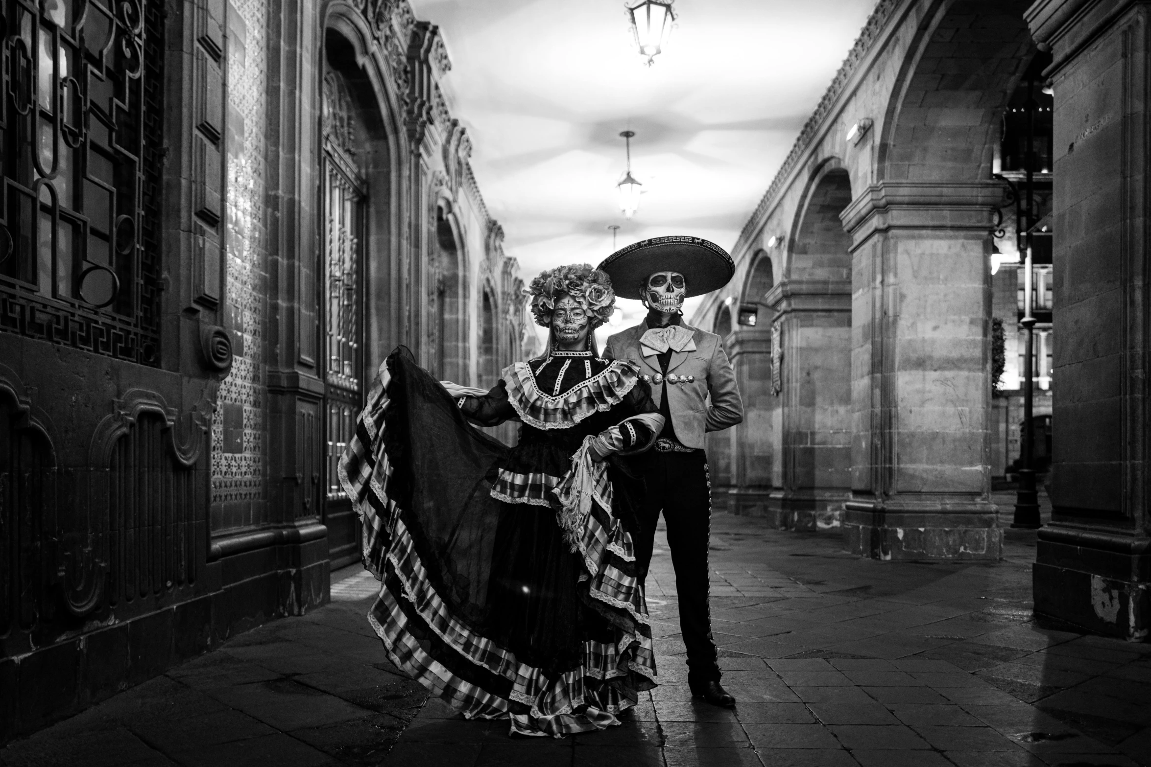 a couple standing next to each other on a street