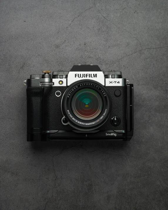 a black and white camera sitting on top of a table