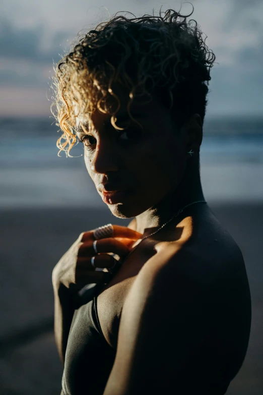 a woman with wavy hair and  on