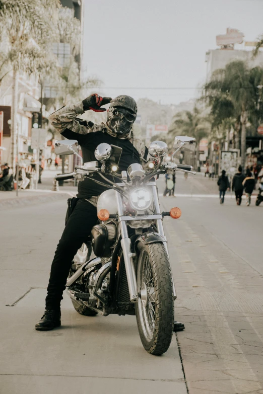 a person riding a motorcycle on a city street