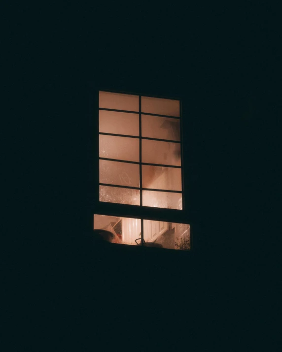 an image of a window at night in the dark