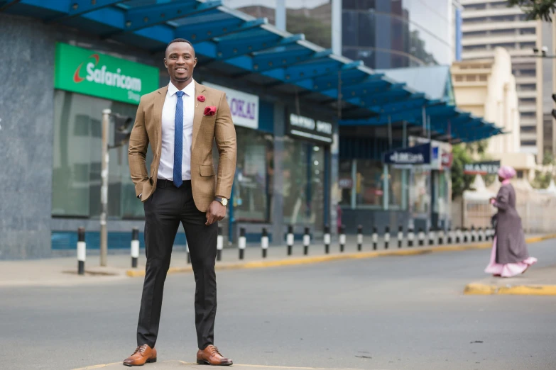 a man is dressed in a suit standing alone