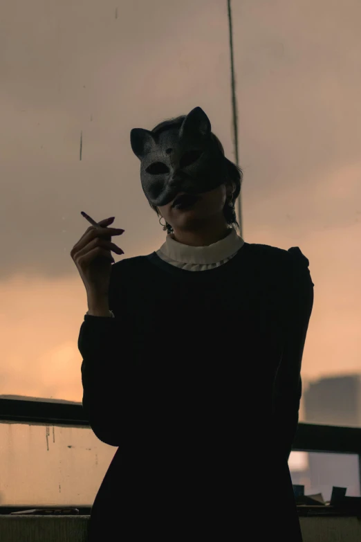 a woman with a mask smoking a cigarette