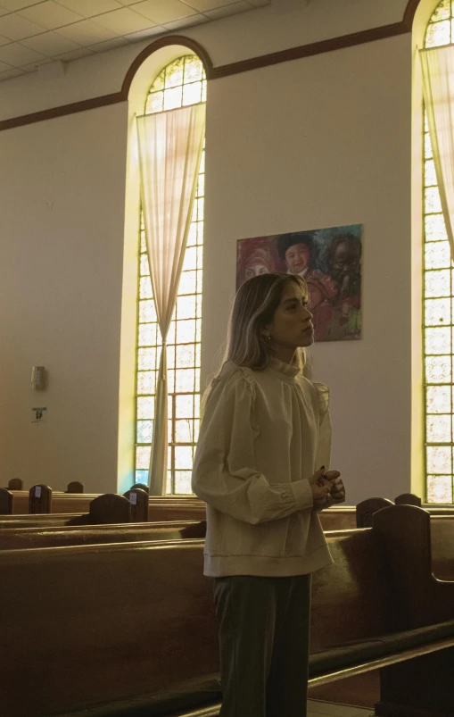 a person in front of the alter of a church