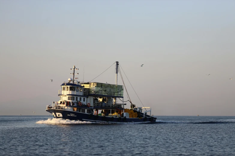 a boat is traveling through the water in the day