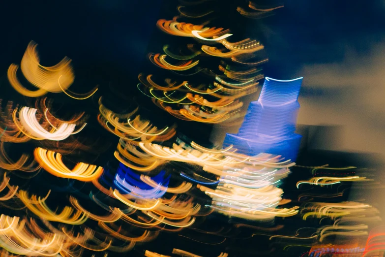 blurry image of various colorful objects in motion